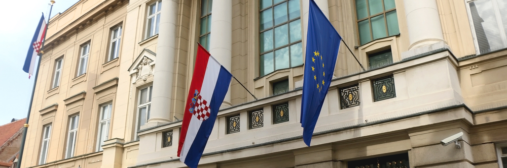 Croatian Parliament building, with flags of European Union and Croatia